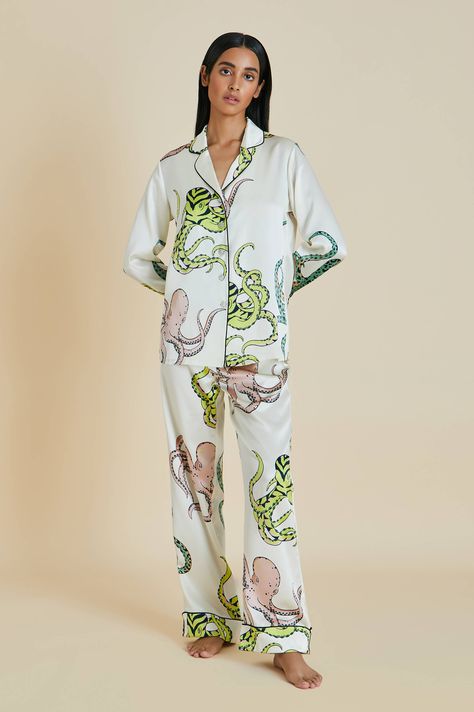 Offering a perfectly pastel palette with elegant details, this 100% silk pyjama set demonstrates our mastery of screen-printed silk this season. Unbelievably soft to the touch—it’s time to dive right in. Product Details Luxury Cream Octopus printed silk pyjama set. Screen printed with a print designed in our London studio, exclusively for Spring/Summer 2022. Peach, Creme, Opal, Sand, Ink and Lime accents. Jet Black piped silk trims. Shirt: traditional notched collar, long sleeves and mother of p Silk Pyjama Set, Pj Day, Satin Pyjama, Silk Pyjamas, Luxury Pajamas, Olivia Von Halle, Octopus Print, Silk Pajama Set, Loungewear Luxury