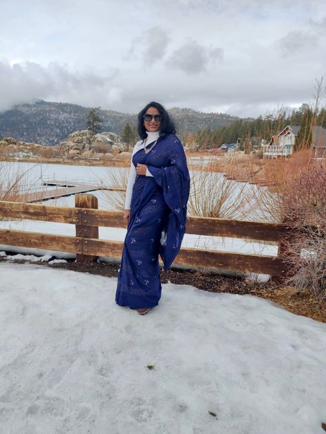 Blue Georgette saree with white turtle neck sweater .. when passion finds a practical solution to wear light saree in snow :) Saree In Snow, Light Saree, White Turtle Neck Sweater, Blue Georgette Saree, White Turtle Neck, Turtle Neck Sweater, Georgette Saree, Georgette Sarees, Turtleneck Sweater