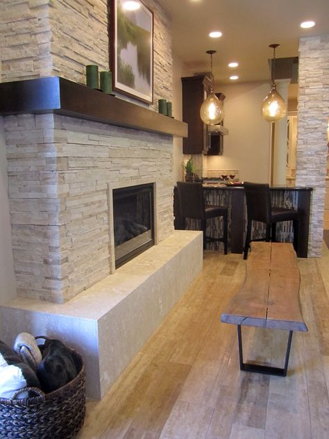 A rustic but modern fireplace. #thetileshop Wood Fireplace Surrounds, Stacked Stone Fireplaces, Fireplace Redo, Rustic Fireplaces, Fireplace Remodel, Wood Fireplace, Home Fireplace, Fireplace Makeover, Modern Fireplace