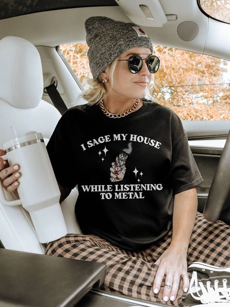 i sage my house while listening to metal, metalhead gifts, witchy sweatshirt, elder emo shirt CHOOSE YOUR PRODUCT: 1. Crewneck Sweatshirt in Black 2. Crewneck T-shirt in Black 🖤 SWEATSHIRTS INFO Printed on Gildan Unisex Sweatshirts! * 50% cotton, 50% polyester * Medium-heavy fabric (8.0 oz/yd² (271.25 g/m * Loose fit * Sewn-in label * Runs true to size * Without side seams 🖤 T-SHIRTS INFO Printed on Gildan Unisex Tshirts!  Up to 3XL printed on Gildan Softstyle, 4XL-5XL printed on Gildan Heavy Elder Emo Work Outfit, Elder Emo Outfits, Emo House, Elder Emo Fashion, Emo Shirt, Elder Emo, Emo Shirts, Heavy Metal Fashion, Emo Outfits