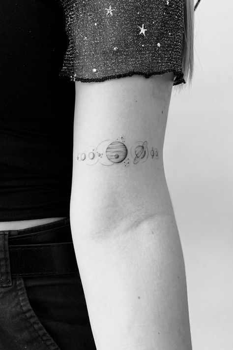 Planet Arm Tattoo, Fine Line Solar System Tattoo, Astronomy Tattoo Cosmos, Planets In A Line Tattoo, Line Of Planets Tattoo, Tiny Solar System Tattoo, Planet Wrist Tattoo, Solar System Band Tattoo, Solar System Arm Band Tattoo