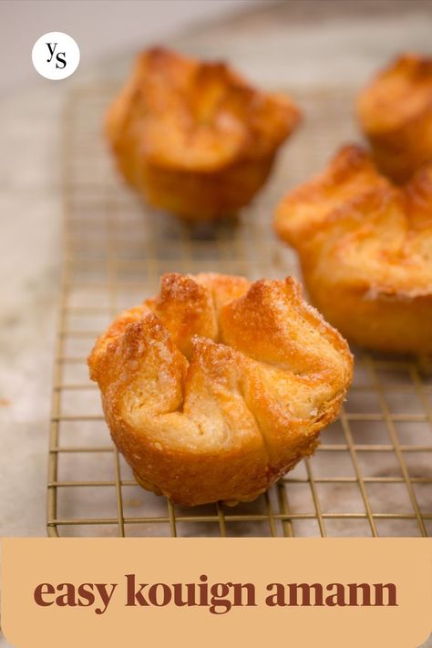 Kouign amann on gold cooling rack, more in background, text "easy kouign amann" Laminated Dough, Butter Block, Kouign Amann, Breakfast Rolls, Food Wishes, Cookies Pastry, Flaky Pastry, Pastry Brushes, Cookie Desserts