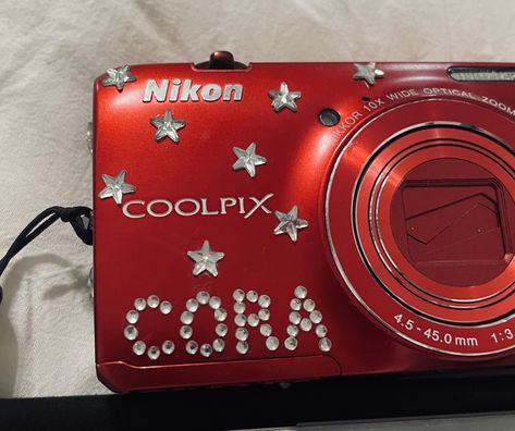 digital camera red bedazzled name nikon coolpix Red Digital Camera Aesthetic, Bedazzled Digital Camera, Nikon Coolpix Aesthetic, Red Digital Camera, Bedazzled Camera, Digi Camera, Old School Movies, Camera Decor, Red Camera