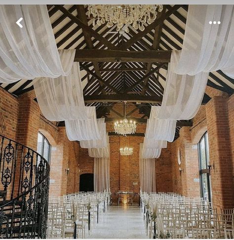 Wedding Ceiling Drapes And Lights, Rafter Decorations Wedding, White Drapery Wedding, Wedding Venue Ceiling Decor, Wedding Drapery Ideas Ceilings, Wedding Draping Ceiling, Tulle Ceiling Draping, Draping Fabric From Ceiling, Back Drops For Weddings Receptions