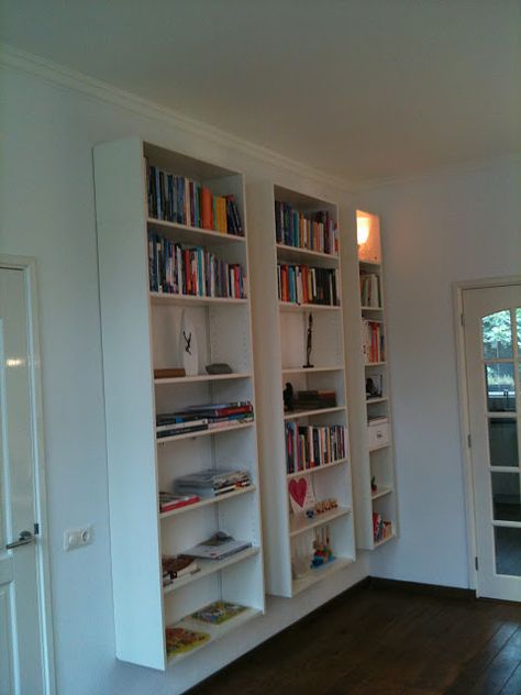 Ikea Billy bookcases mounted to the wall... I would love to do this with the glass doors for my dining room for china and glassware! Cheap Bookcase, Ikea Lack Shelves, Billy Ikea, Diy Space Saving, Billy Bookcase Hack, Ikea Billy Bookcase Hack, Ikea Bookcase, Floating Bookshelf, Floating Bookshelves