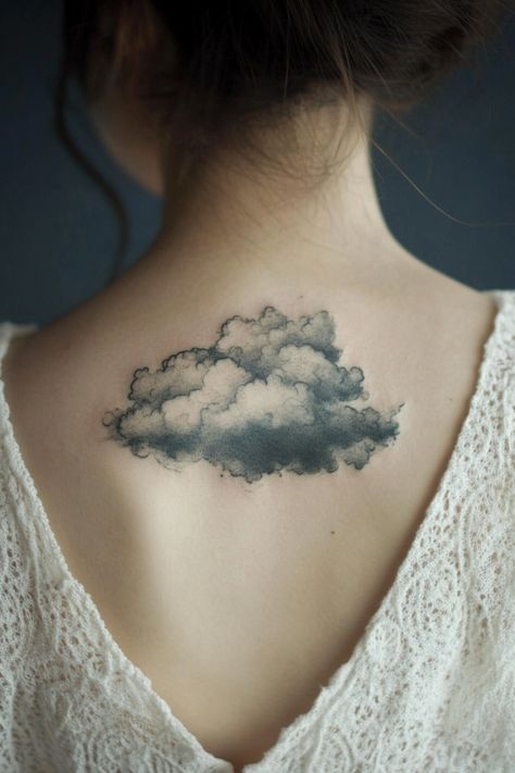 Cloud tattoo on a woman's upper back, visible above a white lace top. Clouds Shoulder Tattoo, After The Storm Tattoo, Thunder Storm Tattoo, Storm Tattoo Ideas, Storm Tattoo For Women, Sun And Clouds Tattoo, Storm Cloud Tattoo, Weather Tattoo, Thunderstorm Tattoo