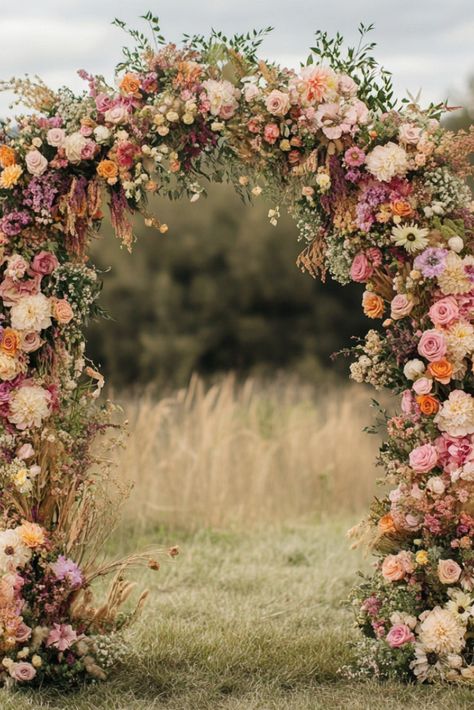 30+ Captivating Wildflower Wedding Themes for a Picture-Perfect Day Grapevine Wedding Decor, Wedding Wild Flowers Centerpieces, Summer Wedding Colors Wildflowers, Backyard Wedding Wildflowers, Colorful Flowers For Wedding, Elegant Garden Wedding Reception, Soft Colorful Wedding, Weddings In A Field, Wedding Decor Wildflowers