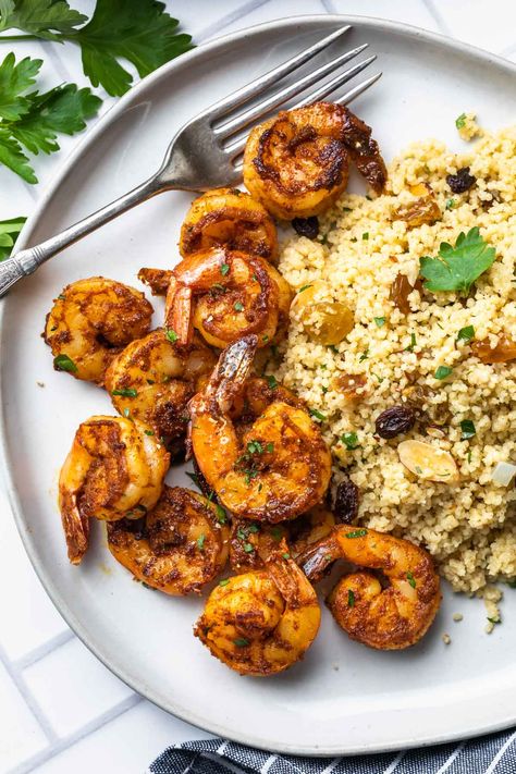 This easy, sweet and spicy shrimp recipe is seasoned with homemade Moroccan seasoning and pan fried until crispy. Pair them with Moroccan couscous or rice and your favorite vegetable for a simple, healthy meal any night of the week. Middle Eastern Shrimp Recipe, Moroccan Shrimp Recipes, Shrimp And Couscous Recipes, Moroccan Shrimp, Mediterranean Board, Arabian Restaurant, Spicy Shrimp Recipe, Shrimp Couscous, Moroccan Seasoning