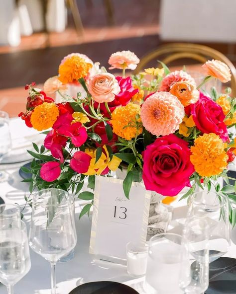 Just a few more details from S&R's vibrant wedding! 💛🧡 Photo: @jimkennedyphotographers @jkp_megan Venue: @olehansonbeachclub Planner: @cortneyhelaine_weddings Florist: @littlehilldesigns Catering: @24carrotscatering Cake: @simplysweetcakery DJ: @extremedjservice HMUA: @flawlessfacesbeautylounge Rentals: @sigpartyrentals Bold Wedding Florals, Coral Centerpieces Wedding, Blue And Magenta Wedding, Wedding Flowers For Tables, Bright Spring Wedding Colors, Wedding Round Table Centerpieces, Vibrant Wedding Decor, Wedding Bright Flowers, Round Table Wedding Centerpieces