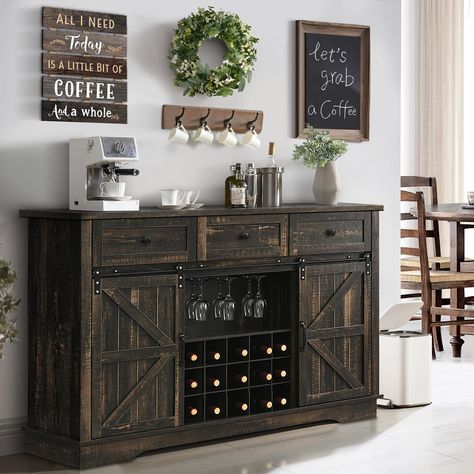 PRICES MAY VARY. RETRO FARMHOUSE DESIGN: The buffet sideboard combines retro dark rustic oak color panels with wood grain texture, and paired rustic barn door with black metal handles, which create a elegant, charming rustic flair. It could blends with any furniture decor and makes your home more beautiful. AMPLE STORAGE SPACE: This sideboard buffet is equipped with 3 drawers and 2 storage cabinets to meet your kitchen storage needs; it is equipped with 15 wine racks and 3 glass racks to meet wi Black And Oak Cabinets, Farmhouse Wine Bar, Farmhouse Buffet Cabinet, Bar Nook, Coffee Bar Cabinet, Farmhouse Sideboard Buffet, Farmhouse Buffet, Home Bar Cabinet, Farmhouse Coffee Bar