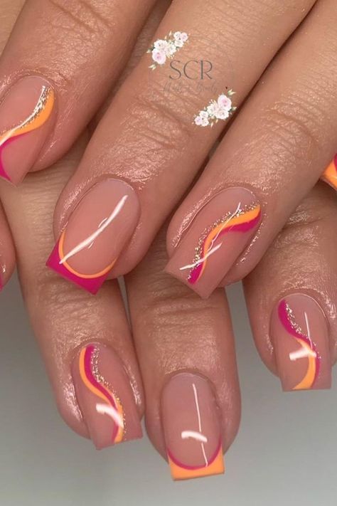 These almond-shaped nails boast a neutral base with vibrant pink and orange French tips, accented by an elegant, wavy design. The juxtaposition of bold and subtle is highlighted with a touch of glitter, providing a playful yet sophisticated look. Perfect for adding a splash of color to your everyday style!  // Photo Credit: Instagram @scr.nails.beauty Holidays Nails Summer, Orange Accent Nails, Orange And Pink French Tip Nails, Pink And Orange French Tips, Pink And Orange French Tip Nails, Neutral Nail Inspiration, Orange And Pink Nail Designs, Pink And Orange Nail Designs, Orange Nails Design