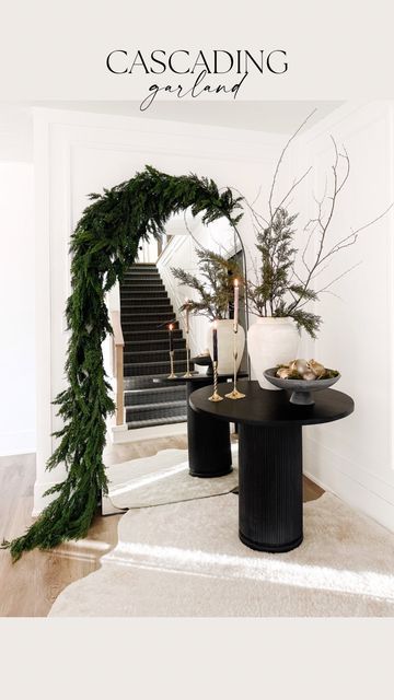 Floor Mirror With Garland, Garland On Big Mirror, Year Round Fireplace Garland, Modern Christmas Dining Room, Christmas Garland On Cabinets, Style A Floor Mirror, Modern Clean Christmas Decor, Garland On Floor Mirror, Hanging Garland Around Mirror