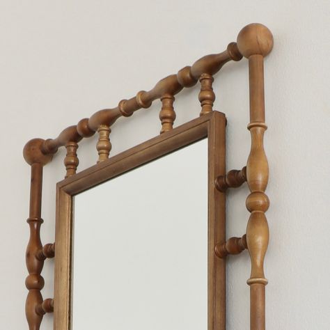 Ships in 2-3 Weeks This Folk Art Spindle Mirror adds dimension and visual interest to your modern farmhouse or boho bungalow. Framed with wooden spindles, this rustic piece looks just like an amazing flea market score! Folk art spindle mirror Two sawtooth hangers on back Mirror measures 13.25"W x 20.5"H Measures 22"W x 2"D x 30.5"H overall Imported Small Narrow Hallway Decorating, Mirror Detail, Wooden Frame Mirror, Modern Folk, Wood Mirror With Spindle, Wood Mirror Frame, Spindle Wooden Bed Frame, Folk Art Frame, Antique Wooden Mirror