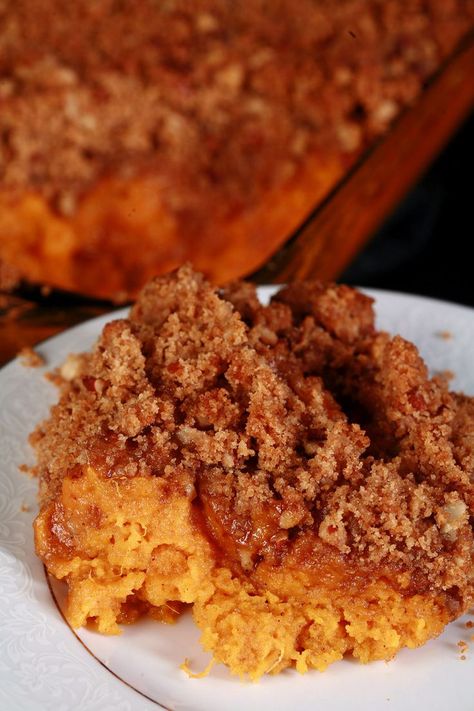 A casserole dish of gluten free sweet potato souffle. Best Sweet Potato Souffle, Maple Sweet Potato Souffle, Sweet Potato Soufflé, Potato Souffle, Maple Sweet Potatoes, Pecan Crumble, Sweet Potato Souffle, Gluten Free Sweet Potato, Souffle Recipes