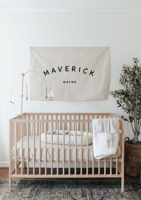 Simple and classic nursery, featuring hand painted name banner Nursery Name Flag, Name Flag Banner Nursery, Nursery Name Banner, Baby Boy Name Signs For Nursery, Above Crib Decor Boy, White Crib Boy Nursery, Name Over Crib, Over Crib Decor, Nursery Corner