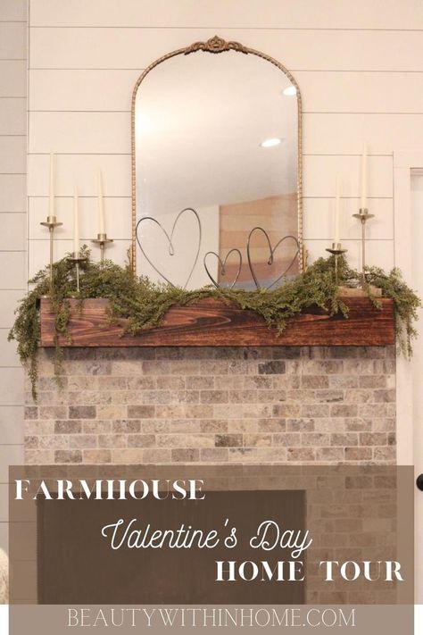 Gold mirror on a wood fireplace mantel with black metal hearts and candles decorated for Valentine's Day Valentines Day Mantel Decorating Ideas, Valentines Mantle Decor Farmhouse, February Mantle Decor, Valentine’s Day Fireplace Decor, Valentines Entryway Decor, Valentine’s Day Mantel Decor, Subtle Valentines Day Decor, Valentine’s Day Mantle, Valentine’s Day Home Decor