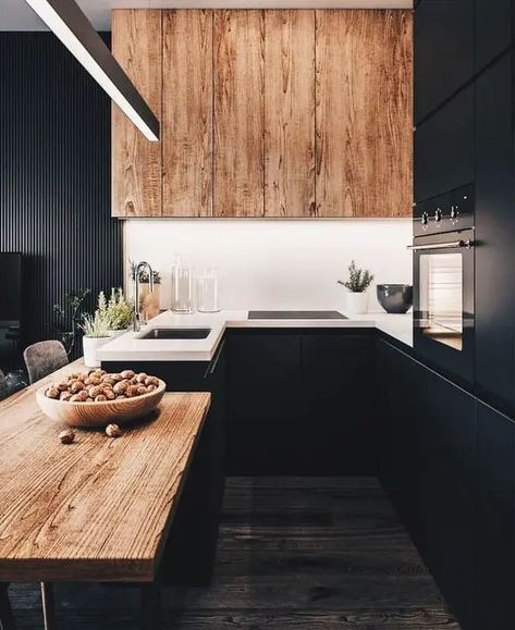 a chic black kitchen with a wooden table and a large hood plus white countertops looks very stylish and bold Small Kitchen Decoration, Black Kitchen Design, Interior Design Per La Casa, Kitchen Table Wood, Kabinet Dapur, Kitchen Black, Wood Kitchen Cabinets, Brown Interior, Black Kitchen