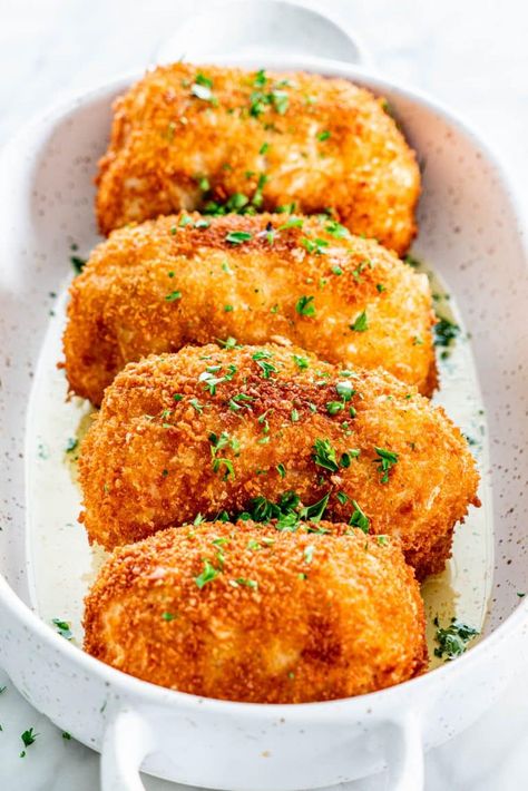 a baking dish with chicken kiev garnished with parsley Homemade Chicken Kiev, Filling Chicken Recipes, Chicken Keiv Recipe, Chicken Kiev Recipe, Chicken Kiev, Kiev, Chicken Dishes Recipes, Poultry Recipes, Chicken Breast Recipes