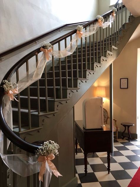 Staircase Wedding Decoration, Tulle On Staircase, Stair Railing Decorating Ideas Wedding, Wedding Banister Decorations, Stairway Decorating Wedding, Wedding Decor Staircase, Boxwood Decor Ideas Wedding, Wedding Flowers For Staircase, Hallway Wedding Decorations