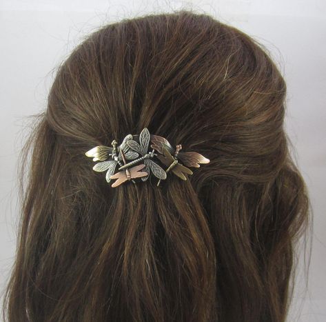 "Six beautifully detailed brass Dragonfly stampings are soldered together and atop the Genuine 70mm French Clip to create this lovely Barrette. A thick anti-tarnishing plate is professionally plated, oxidized to bring out the intricate detail in each piece, hand satined and lacquered to further insure this will never tarnish. No special care is required. Amazingly lightweight. The mixed metal combination of copper, silver and brass creates depth, contrast and realism. Looks great on every hair c Fairy Grunge Hair Accessories, Fantasy Hair Clip, 90s Hair Accessories, Dragon Fly Hair Clip, Pretty Barrettes, Moth Hair Pin, Dragonfly Hair Clip, French Pin, Metal Hair Clips Vintage