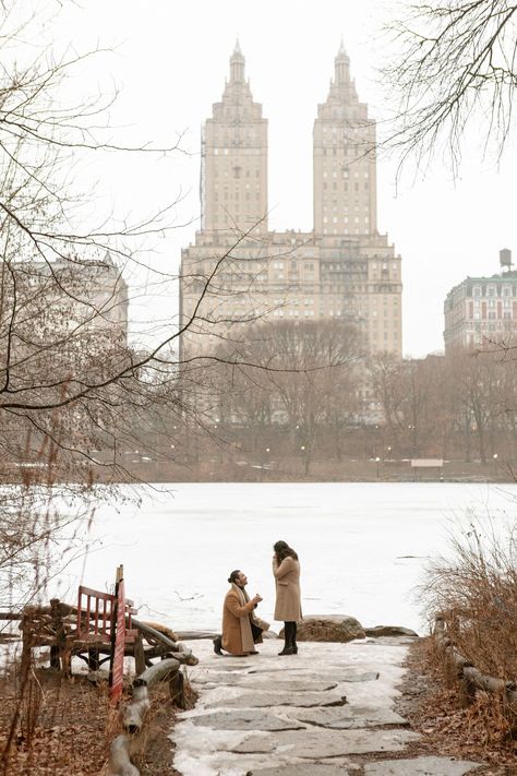 A man proposes on one knee with the Eldorado as a backdrop by the frozen Lake in Central Park New York City. Nyc Winter Proposal, New York Winter Proposal, Central Park Lake, Proposal Ideas New York, Proposal New York, Proposal Central Park, Central Park Couple, New York Facts, Proposal Pics