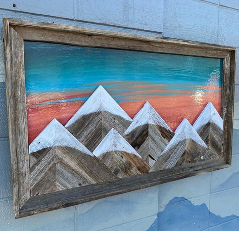 New six mountain Barnwood wall art with peach and turquoise sunset sky. Huge sale still going on!! Custom order whatever you want!! Order online or call #888-404-2739. Coloradoskichairs.com - - - #upgrade #wallart #gifts #handpainted #barnwood #rusticchic #mountainsarecalling #mountainliving #chair #relax #support #love #mountains #ottoman #rustichic #buylocal #mountainlife #repurpose #handmade #woodworking #homedecor #skiing #shoplocal Peach And Turquoise, Wine Barrel Chairs, Custom Outdoor Furniture, Barnwood Wall Art, Acrylic Techniques, Mountain Mural, Fire Pit Chairs, Colorado Ski, Barnwood Wall