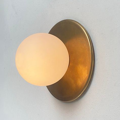 The design of this wall sconce winks at old Hollywood dressing tables. There are no visible mounting screws, allowing the clean geometry and artisanal metals to shine. (get it? shine?) The first iteration of this design was for a client in the Chelsea neighborhood of New York and I have called it the "Chelsea Fixture" ever since. This is the mini-version of the full sized fixture, available in the shop. Bathroom Lights Modern, Sconces For Kitchen, Vanity Light Fixtures Bathroom, Powder Room Sconces, Wall Sconces Bathroom, Lamp For Bathroom, Wall Lights Bathroom, Bathroom Wall Light Fixtures, Wall Mounted Lights