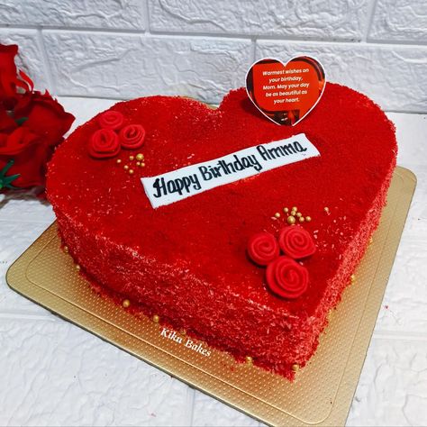 Baked with love 💕 Celebrate your mother's birthday with a decadent heart-shaped Red Velvet cake adorned with delicate fondant roses and shimmering golden sugar balls. The rich crimson hue of the cake symbolizes love and warmth, while the intricate fondant roses add an elegant touch, showcasing the beauty of her special day. Each bite offers a harmonious blend of velvety smoothness and indulgent sweetness, making every moment memorable and cherished. Whether presented as a centerpiece or serv... Velvet Cake Decoration, Heart Shape Cakes, Red Velvet Cake Decoration, Fondant Rose, Baked With Love, Heart Shaped Cakes, Mother Birthday, Anniversary Cake, Red Velvet Cake