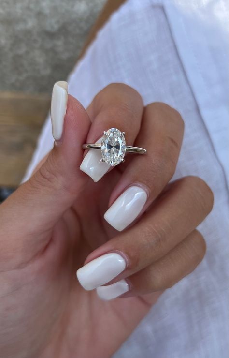 🎁We have extended our returns and exchange policy: Contact Us within 14 days of delivery Ship items back within 30 days of delivery 2 Carat Oval Solitaire Moissanite Engagement Ring, low profile setting, 14\18k solid gold unique GioielliRings design makes a regal statement that is bound to become a family heirloom. MORE INFORMATION ❥ The craft period is about 10-14 business days. ❥ Free shipping via DHL ❥ Available in a combination of 14kt, 18kt  Rose Gold, Yellow Gold, White Gold ❥ Arrives in our box, ready for gift-giving (and proposing ) ❥ GioielliRings MAIN STONE  Type: Moissanite   Size: = 10.5x7 2ct approx  Shape: oval  Color: DF /VVS SIZING Ring Sizes range from 4-9 US.  If you have any questions about sizing, please do not hesitate to reach out! Cute Engagement Rings, Oval Engagement Ring, Future Engagement Rings, Moissanite Engagement Ring Solitaire, Oval Engagement, Oval Moissanite, Engagement Ring White Gold, Dream Engagement Rings, Hidden Halo