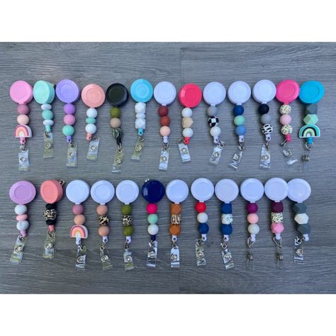 Silicone Beaded Badge Reel | Nurse Id Badge Reel | Nurse Accessories | Retractable Badge Reel | Resin Badge Reel | Work Badge | Badge Reel Custom Badge Reels Are A Convenient Way To Wear And Display Id Without Compromising Card Accessibility. Especially Useful For Cards That Need To Be Swiped Or Scanned On A Routine Basis, This Personalized, Retractable Badge Reel Would Make A Great Gift. Badge Reel Details Reel Diameter - 1.5" Retractable Cord Length - 24" 3 Badge Reel Colors - Clear, Black And Badge Reels Diy Ideas, Fob Logo, Resin Badge Reel, Beaded Badge Reel, Nurse Accessories, Resin Badge, Louis Vuitton Key Holder, Red Lizard, Nursing Accessories