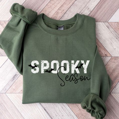 Celebrate Spooky Season in this simple Halloween bat sweatshirt for women. Ideal for any situation, a unisex heavy blend crewneck sweatshirt is pure comfort. These garments are made from polyester and cotton. This combination helps designs come out looking fresh and beautiful. The collar is ribbed knit, so it retains its shape even after washing. There are no itchy side seams on these sweaters.  .: Made with a medium-heavy fabric blend of 50% cotton and 50% polyester (8.0 oz/yd² (271.25 g/m this Fall And Halloween Shirt Ideas, Spooky Season Shirt, Halloween Sweatshirts Cricut, Diy Halloween Sweatshirt, Fall Sweatshirt Ideas, Crucit Ideas, Bat Sweatshirt, Sweatshirt Sayings, Cute Halloween Shirts