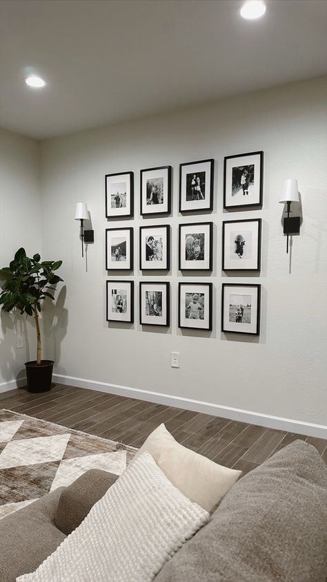 Picture wall, family picture wall, gallery wall, living room decor, neutral home decor, sconces Lounge Room Photo Wall, Small Living Room Picture Wall, Home Picture Wall Ideas, Family Pictures Frame, Gallery Wall And Sconces, Lounge Photo Wall Ideas, Family Picture Decorating Ideas, Photo Wall Collage With Sconces, Photo Gallery Wall With Sconces