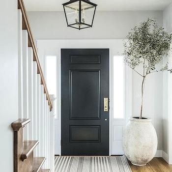 Black Interior Front Door Entry Ways, Black Front Door Interior Entryway, Front Door Interior Entryway, Black Front Door Interior, Black Interior Front Door, Transitional Home Exterior, Black Entry Doors, Black Metal Dining Chairs, Black Exterior Doors