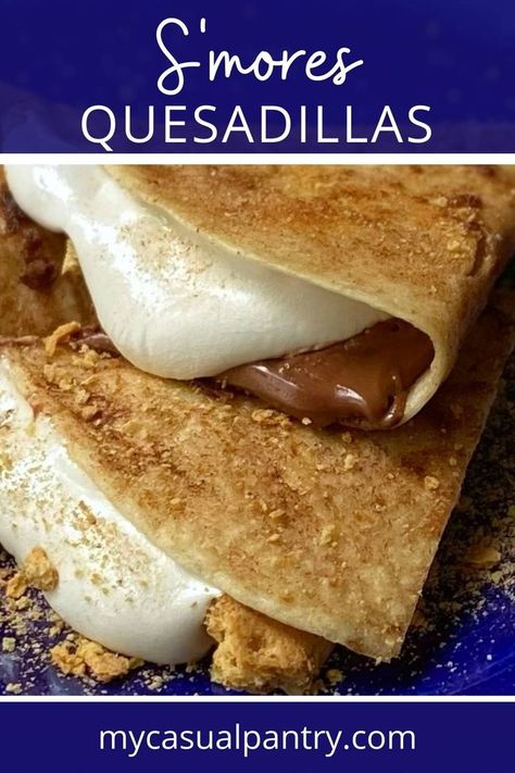 slices of s'mores quesadilla on a plate with melted marshmallow oozing out. Tortilla Camping Recipes, S’mores Quesadilla, Smore Quesadilla, S'mores Quesadilla, Blackstone Smores Quesadilla, S’mores Tortilla, Tortilla Sweet Desserts, Grilled Tortillas, Smores Quesadilla