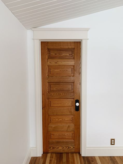 Solid Pine Interior Doors, 1950s Doors Interior, Oak Doors And Floors, White Walls Stained Doors, Wood Doors With Painted Trim, Wood Door Bathroom, White Walls Wood Doors, Stained Doors With Painted Trim, Old Farmhouse Trim