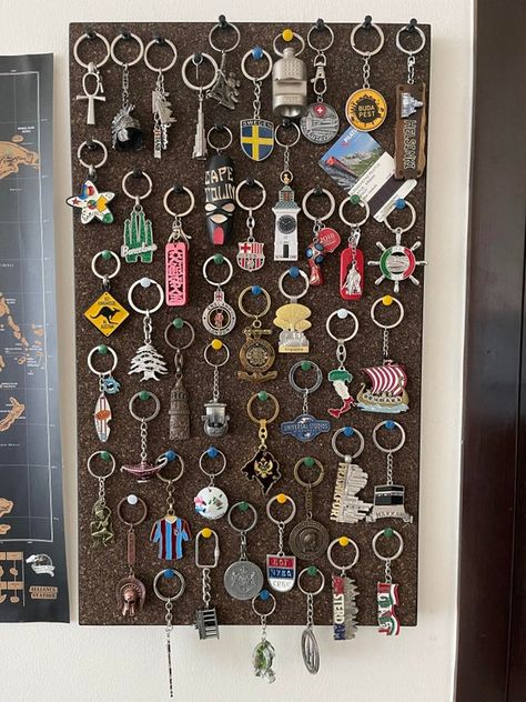 Keychains collection from my travels, I thought this is the best way to display them : travel Keychain Souvenir Ideas, Keychain Decor, Travel Magnets Display, Travel Ornament Display, Souvenir Organization Ideas, Travel Souvenirs Display Wall Shelves, Souvenir Wall Display, Keychain Storage, Keyring Collection Display