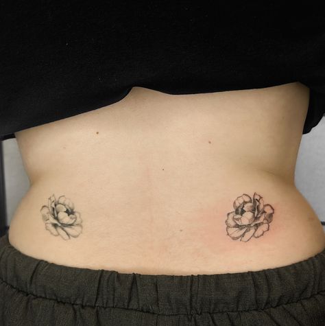 Symmetrical lower back rose tats for Clara. We started this concept with just the single rose on the left side (healed). It was her first tattoo so I recommended we handpoke it since it’s such a gentle and low trauma process. We had a lovely first session and a couple months later she decided to get the second one to complement the first. The placement couldn’t have been more perfect for these two sweet roses. This a great example of how handpoked tattoos look fresh vs a couple of months se... Lower Back Side Tattoo, Back Side Tattoo, Rose Tats, Rose Tat, Two Sweet, Side Tattoos, Single Rose, Hip Tattoo, Tattoo Placement