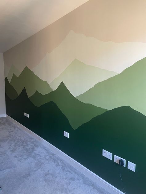 Mural On Green Wall, Mountain Painted Wall, Easy Mountain Mural, Green Mountain Mural, Accent Wall Kids Bedroom, Mountain Mural Kids Room, Easy Mural Ideas Diy, Mountain Wall Painting, Cabin Basement