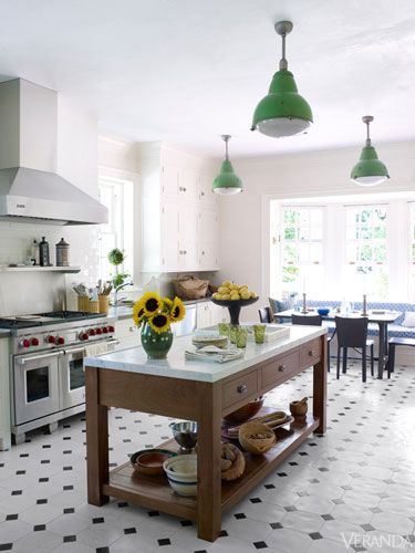 With black-and-white tiled floors and vintage pendants, this renovated kitchen seems pristinely original. Black Tiles Kitchen, White Subway Tile Kitchen, Kitchen Floor Tiles Ideas, Kitchen Tiles Design, White Tile Floor, Tiles Kitchen, Black And White Tiles, Classic Kitchen, Subway Tiles