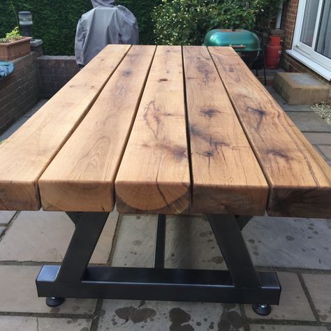 Photo by Peter C. Here is how Peter created with fantastic table with our sleepers: 
“Heavy duty patio table that I made using the 100x200x2400 oak sleepers I purchased from your company. I fabricated the frame from 100x100 steel box section steel, fully welded and strengthened & then had it powder coated graphite grey. The sleepers are fixed to the frame using 8mm stainless steel coach screws. This is probably the most heavy duty patio table available & hopefully it will last for many years.” Sleeper Table Garden, Sleeper Table, Oak Sleepers, Wood Company, Table Garden, Gardening Projects, Landscape Projects, Patio Table, Pallet Table