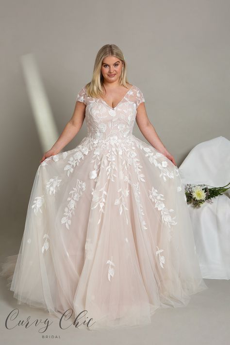 <p>Enhance your wedding day with our V-neck off-shoulder plus-size A-line wedding dress Wyatt. This gown features a sweetheart neckline, delicate embroidered floral fabric, and a flattering Bardot off-shoulder design, seamlessly blending modern style with timeless romance.</p> <p>The V-neck off-shoulder neckline elegantly frame your shoulders with a hint of vintage charm, ensuring a secure and comfortable fit. The sweetheart neckline is both romantic and flattering, enhancing your natural beauty.</p> <p>Wyatt features embroidered floral fabric adding a whimsical and ethereal touch to this A-line wedding dress, making it a true standout on your special day.</p> <p>Choose this gown to exude confidence, comfort, and style as you walk down the aisle, making your wedding day unforgettable. It&# Wedding Dress Curvy, Dress Curvy, Plus Size Bridal, Plus Size Wedding Dress, Wedding Dress White, White Roses Wedding, Wedding Dresses Blush, Chic And Curvy, Bridesmaid Colors