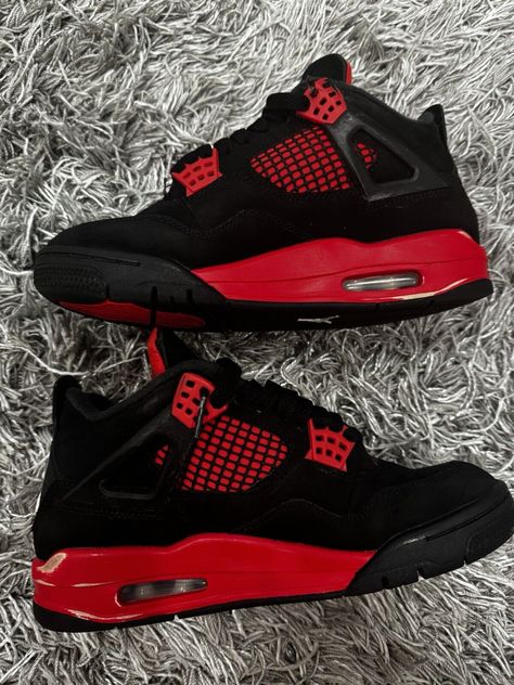 Elevate your sneaker game with these stylish Air Jordan 4 Retro Mid Red Thunder sneakers. Crafted with a mid-top shoe shaft style, these sneakers feature a striking black, multi-color, multi-color, and crimson colorway that is sure to turn heads. The style code, CT8527016, and release date, 20220116, add to the exclusivity of these sneakers. These sneakers are perfect for any athletic occasion and are designed with comfort in mind, making them an ideal choice for any active man. With a US shoe size of 4.5, these sneakers are a great fit for those with smaller feet. Don't miss out on the chance to own these stunning Air Jordan 4 Retro Mid Red Thunder sneakers. Jordan Air Red, Red And Black 4s, Air Jordan 4 Thunder, Red Thunder 4s, Jordan 4 Red Thunder, Aesthetic Nike, Jordan 4 Red, Air Jordan Retro 4, Birthday Fit