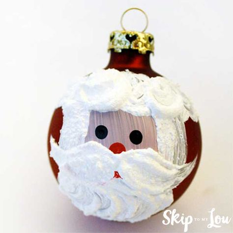 Hand Painted Santa DIY Ornaments are easy to make with a glass ball ornament and a little paint.  Tie it to the top of a gift package or give it alone as a nice little gift handmade by you! Santa PAINTED Ornament SUPPLIES To make the Santa you will need one medium size round ornament,… Homemade Santa Ornaments, Diy Santa Ornaments, Paint Santa, Paint Ornaments, Painted Santa, Diy Santa, Diy Christmas Ornaments Easy, Diy Ornament, Santa Crafts