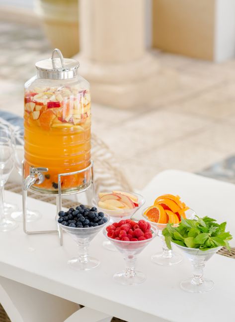 Lately I have been trying to make more creative cocktail stations for my parties so when I hosted a Mom’s Night Out at my house last week I created this sweet Sangria Bar with a yummy selection of toppings for everyone to garnish their drinks. Key elements to this display are a fun drink dispenser {I got this one at West Elm. It’s... Diy Sangria Bar, Diy Sangria, End Of Summer Party, Sangria Bar, Food Display Table, Cocktail Station, Fashionable Hostess, Drink Garnishing, Cocktail Garnish