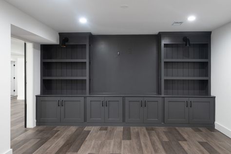 Tv Wall In Basement, Dark Gray Entertainment Center, Basement Ideas Entertainment, Basement Remodel Fireplace, Basement Tv Cabinet Ideas, Diy Basement Built Ins, Built In Basement Entertainment Center, Dark Gray Built Ins, Finished Basement Built Ins