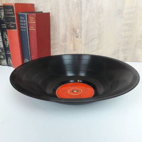 A real smooth Vinyl Record made from real classic records. Perfect for the music lover in your life.Choose from our popular artists from the drop down lists.If you do not see your favourite we may have it in stock or can buy in records for you. Both labels are laminated to protect and add shine to the labels.All bowls will be 100% original vinyl with great labels on both sides. Any replica labels will be stated along side the listed album artist title.We also can make labels for you to resemble any album or artist or a song for both sides of the record. This could be a replica of an actual real label or one for song that was never available on vinyl.We can also print your photos on the labels - please ask. OTHERS AVAILABLE: TOO MANY TO LIST PLEASE ASK IF YOU DO NOT SEE YOUR CHOICE ON THIS