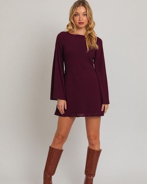 Bell-Sleeve Dress https://linktr.ee/angelcollections.in A bell-sleeve dress identifies itself with the sleeve ending at the mid-forearm or wrist, with a flare flowing down towards your hands. The sleeve is shaped like a bell, hence the dress name. These dresses come in different silhouettes, but the focal point is the sleeves dresses.... #angelcollections Dark Purple Dresses, Bell Sleeve Mini Dress, Fits Inspiration, Dress Name, Autumn Fits, Fancy Dinner, Long Sleeve Short Dress, Bell Sleeve Dress, Boat Neckline