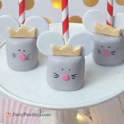 These Mouse King Marshmallow Pops are so easy to make and perfect for your Christmas Nutcracker Ballet theme party! You will need: marshmallows white candy melts black candy melts Necco wafer candies white fondant gold food color spray pink confetti sprinkles black edible marker lollipop sticks Melt a bag of white candy coating and about...Read More » Mouse Party Ideas Mice, Nutcracker Ballet Birthday Cake, The Nutcracker Birthday Party, Nutcracker Themed Treats, Nutcracker Cake Pops, Nutcracker Treats, Nutcracker Tea Party, Nutcracker Birthday Party, Nutcracker Ballet Party