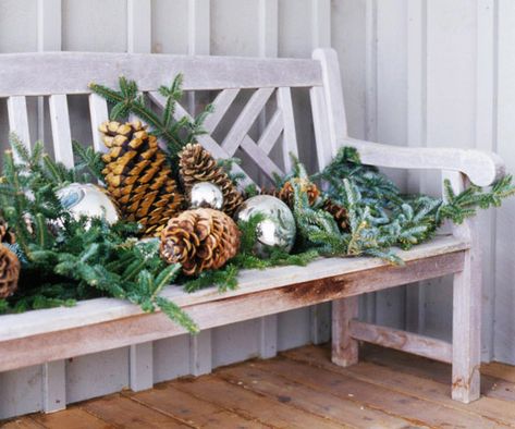 entryway bench covered with branches from the xmas tree, oversize silver ornaments, collection of huge pinecones Best Outdoor Christmas Decorations, Simple Holiday Decor, Holiday Greenery, Fun Christmas Decorations, Christmas Porch Decor, Outdoor Holidays, Outdoor Holiday Decor, Outdoor Christmas Lights, Christmas Porch