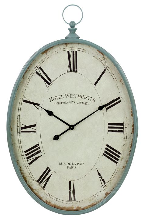 Features:  -Frame material: Iron.  -Finish: Distressed teal-blue.  -Unique oval shape and pocket watch handle.  -Roman numeral clock face.  -High quality quartz movement.  -Uses 1 AA battery (not incl Monogram Wall Clock, Vintage Wall Clock French Country, Light Teal Color, Eclectic Style Decor, Wall Clocks From The 1900s, Vintage Pocket Watch, Tabletop Clocks, Roman Numeral, Light Teal